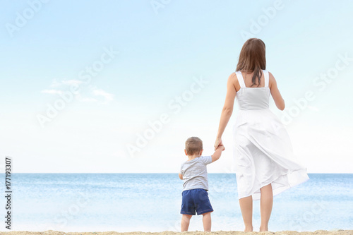 Happy mother with little so...