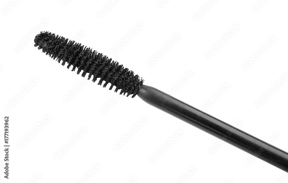 Brush of mascara on white background