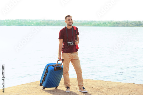 Handsome young tourist with...