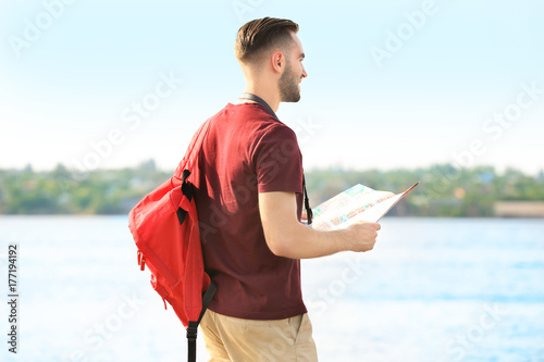 Handsome young tourist with...