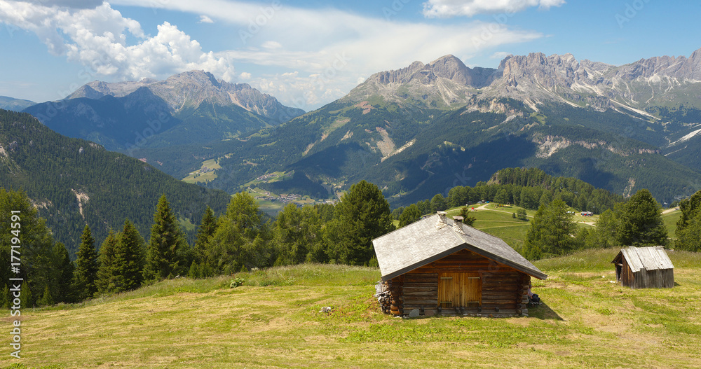 Woody cabin and Dolomites, Italy