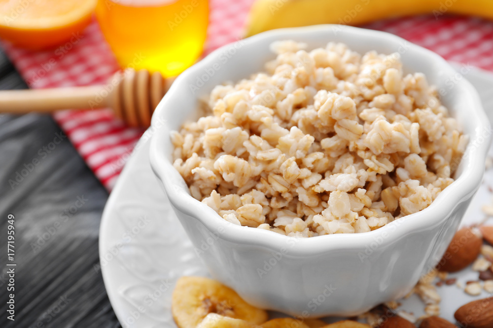 Tasty oatmeal in bowl for breakfast on table Tasty oatmeal in bowl for breakfast on table