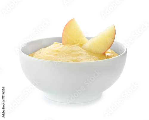 Bowl with porridge for baby on white background