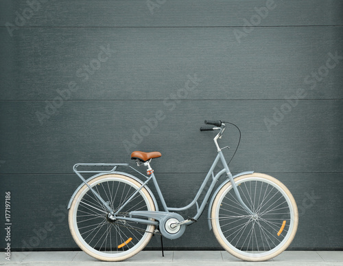Retro bicycle near color wall