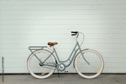Retro bicycle near white wall