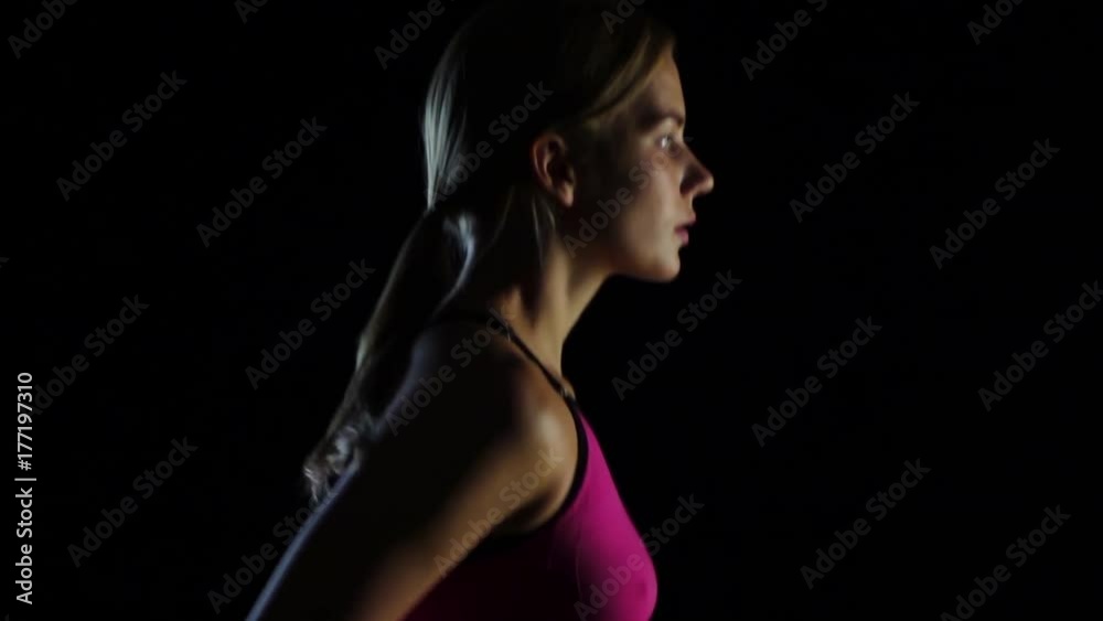 Slow shooting from the top down running athletes on a black screen. Slow motion. Close up Slow shooting from the top down running athletes on a black screen. Slow motion. Close up