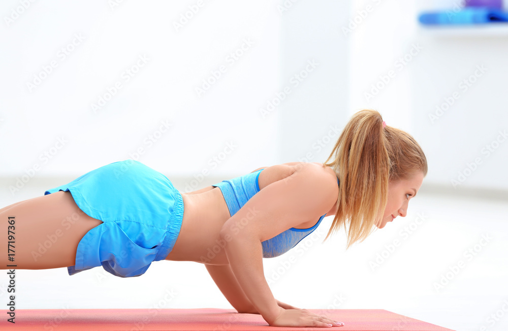 Beautiful young woman training in gym Beautiful young woman training in gym