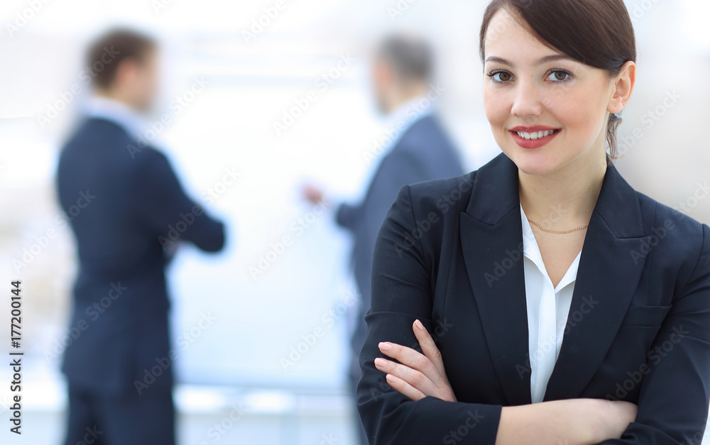 successful young business woman on the background of the office. successful young business woman on the background of the office.