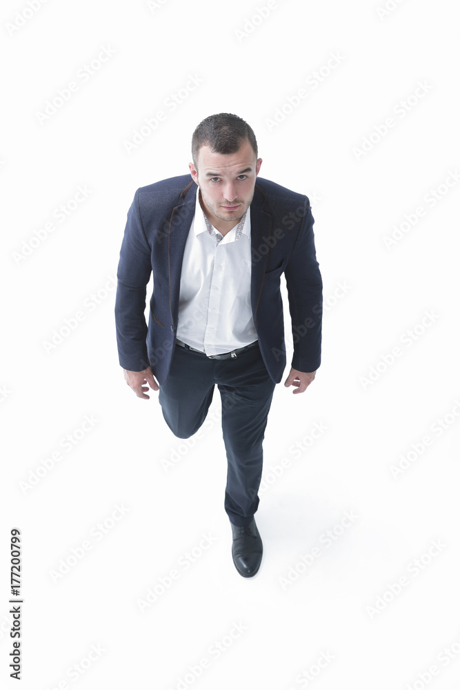 in full growth.top view of successful businessman goes forward. in full growth.top view of successful businessman goes forward.