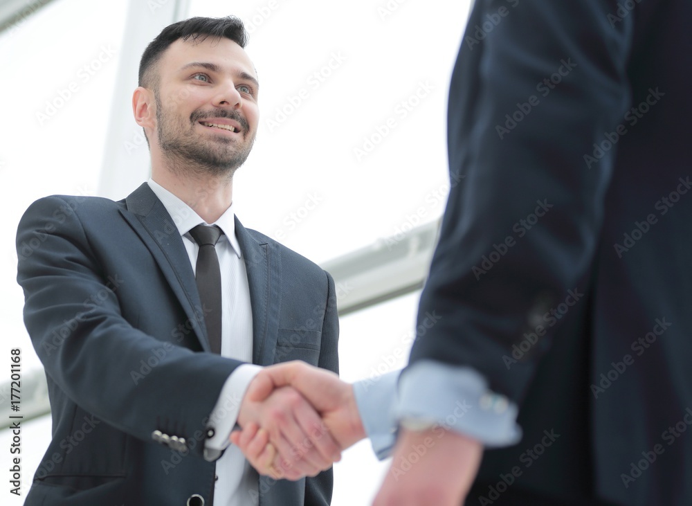 handshake of business partners after a favorable trade deal