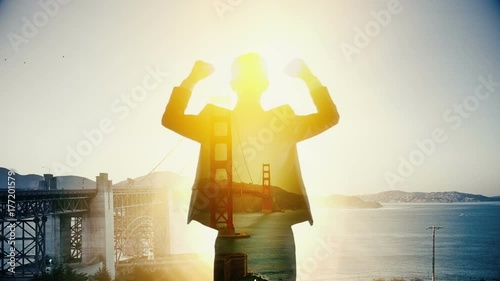 Businessman happy looking Golden Bridge San Francisco cityscape. Double exposure photo