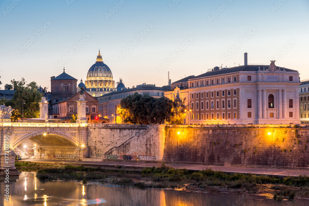 ROME, ITALY - JUNE 22, 2017: Amazing Sunset view of Tiber River and St. Peter's Basilica from St. Angelo Bridge in Rome, Italy