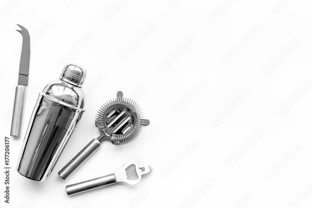 Barman equipment. Shaker, strainer on white background top view copyspace Barman equipment. Shaker, strainer on white background top view copyspace