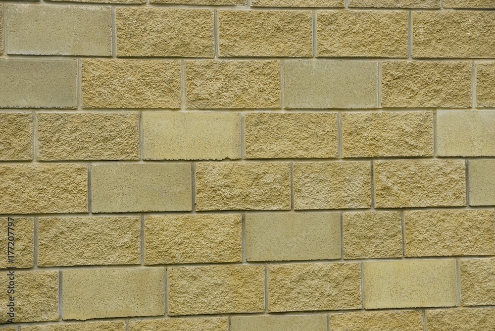 Fototapeta premium коричневая текстура из фрагмента кирпичной кладки на стене дома