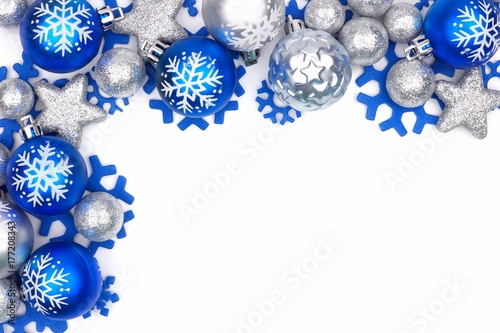 Christmas corner border of blue and silver ornaments isolated on a white background