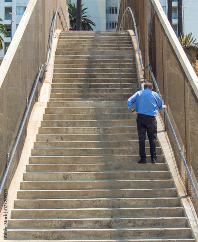 Stair climb man tired fatigue old elderly exercise