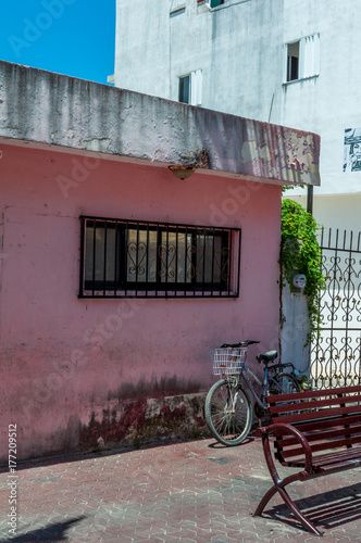Pink Concrete Shop With Metal Bars and Bicycle - Playa Del Carmen
