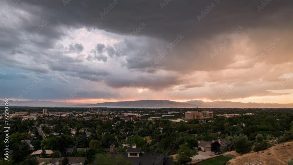 Sunset time lapse over looking Provo towards Utah Lake as storm clouds move by. Sunset time lapse over looking Provo towards Utah Lake as storm clouds move by.
