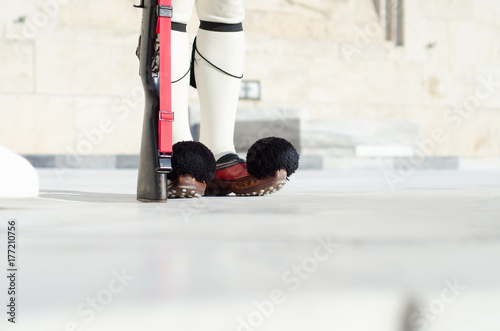 Tsolias or known as Evzones is Greeces historic presidential guard Syntagma.Tsarouhi is a type of shoe, which is typically known as part of the traditional uniform by the Greek guards