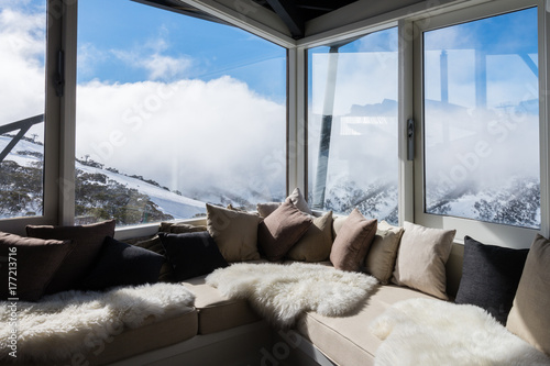 interior of alpine chalet looking over mountains
