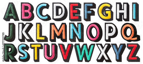 English alphabet of stitched with thread isolated on white background photo