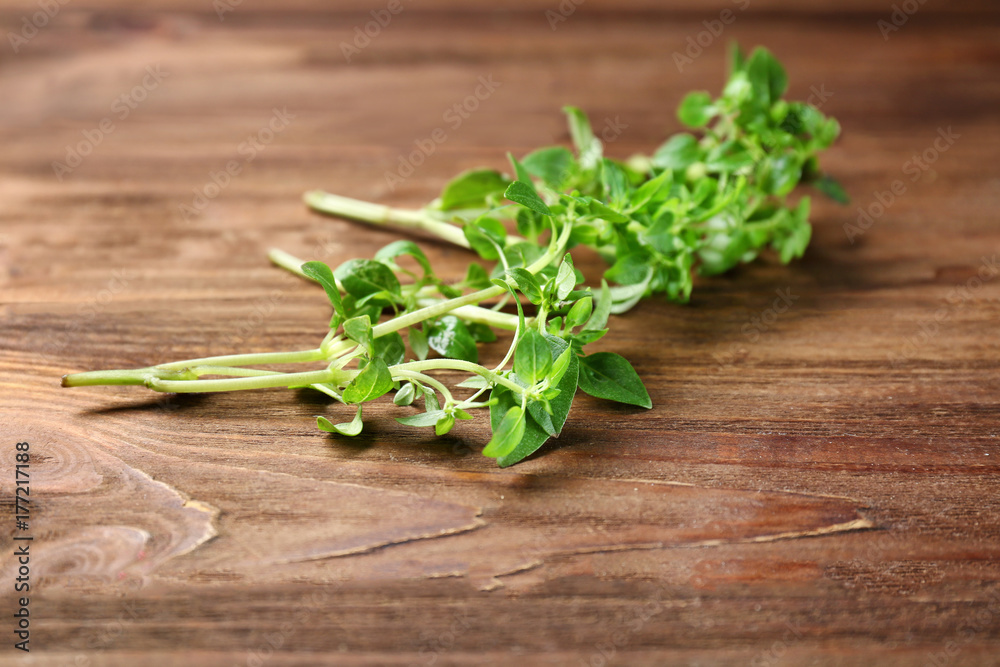 Fresh aromatic oregano on wooden background Fresh aromatic oregano on wooden background