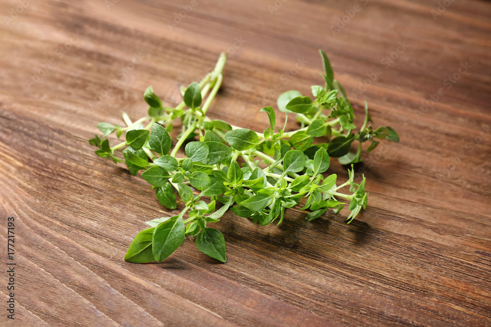 Fresh aromatic oregano on wooden background Fresh aromatic oregano on wooden background