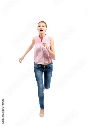 Young woman running on whit...