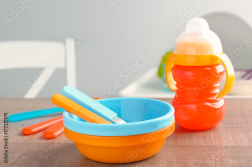 Bright baby dishware on table