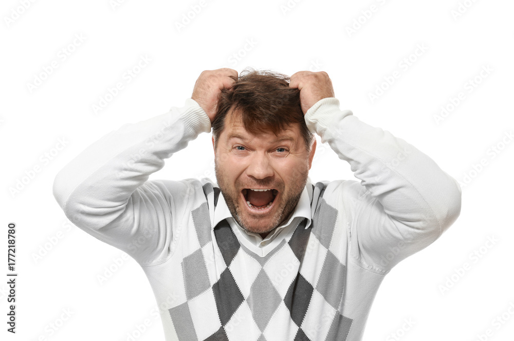 Man in sweater pulling his hair on white background Man in sweater pulling his hair on white background