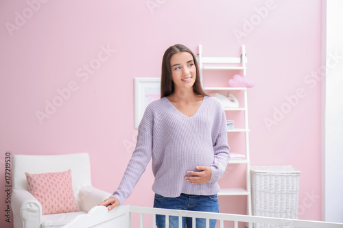 Pregnant woman standing in ...