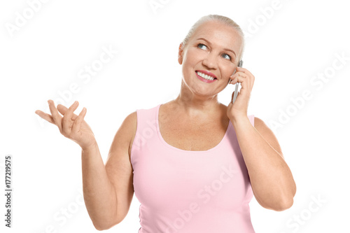 Senior woman speaking on ce...