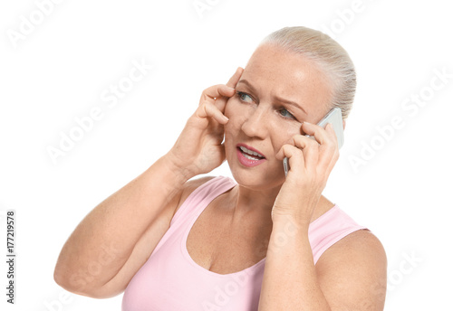 Senior woman speaking on ce...