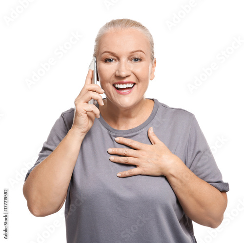 Senior woman speaking on ce...