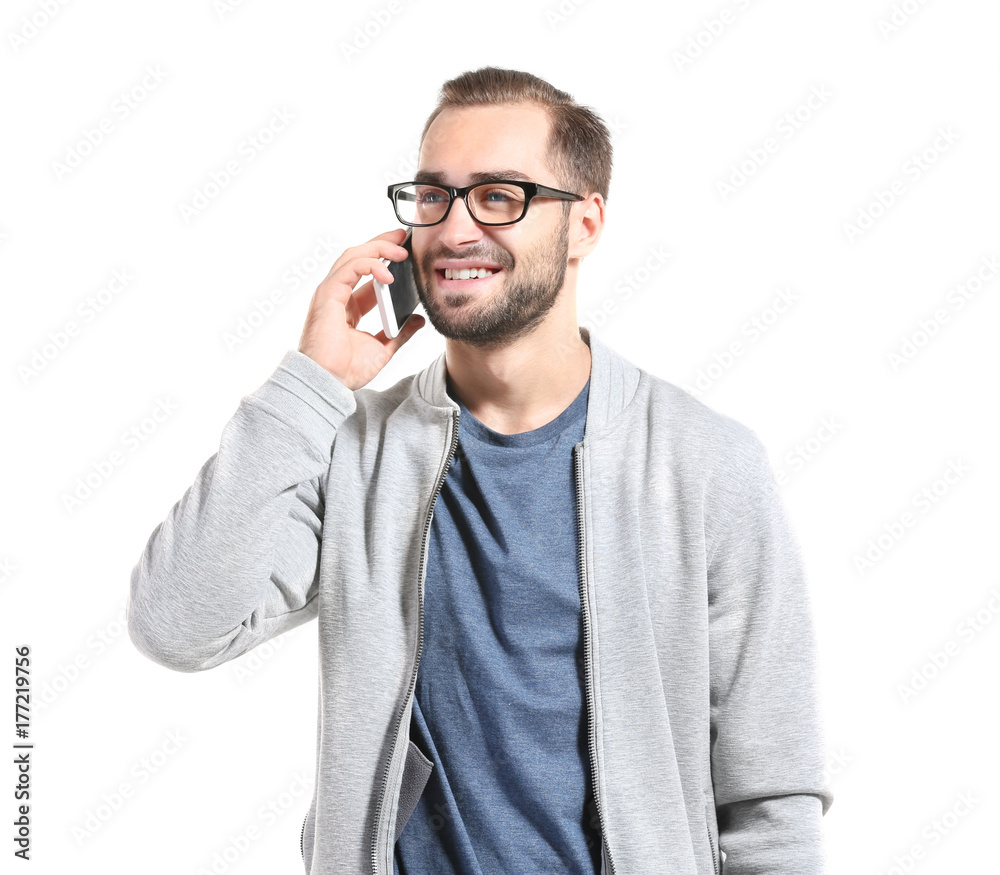 Attractive young man with smartphone on white background Attractive young man with smartphone on white background