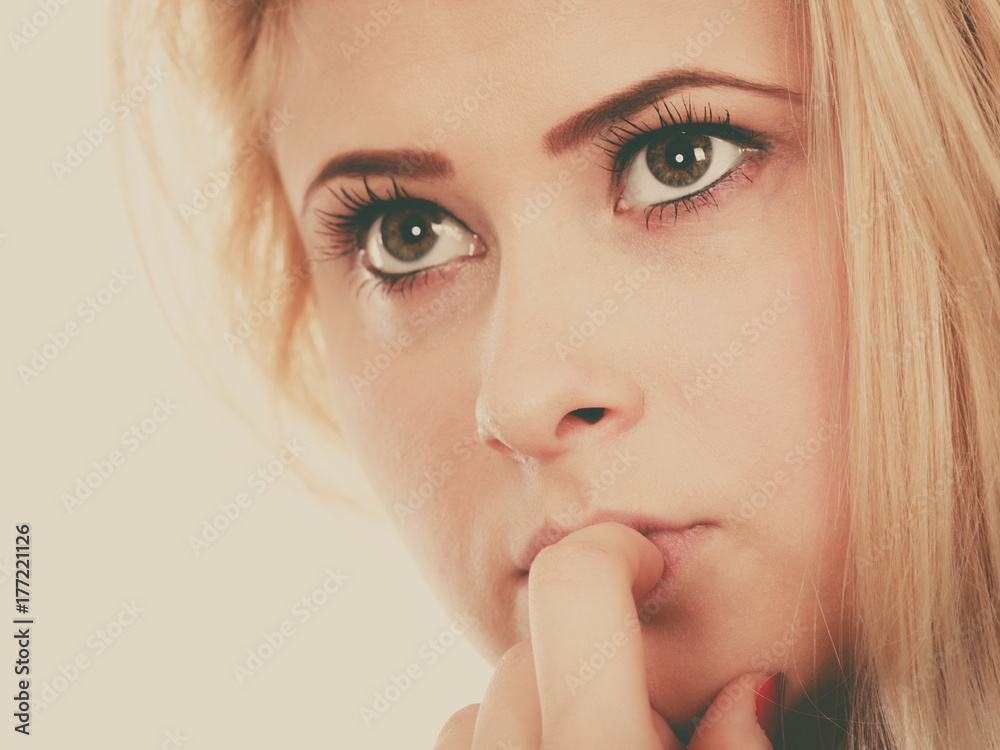 Attractive blonde woman thinking and contemplating Attractive blonde woman thinking and contemplating