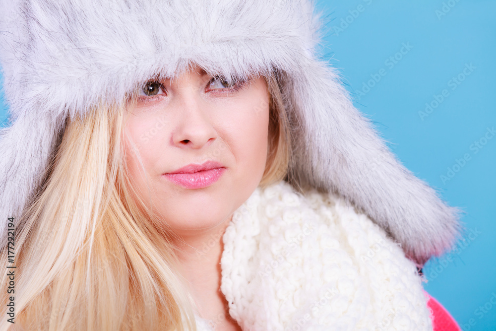 Blonde woman in winter furry hat