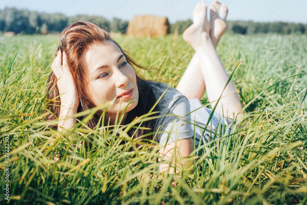 Girl in an autumn field with hay stack Girl in an autumn field with hay stack