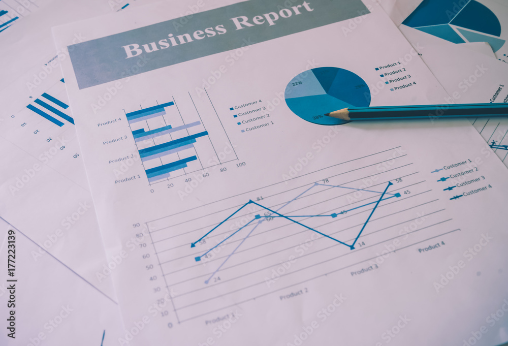 Many charts and graphs with pen-pencil. Reflection light and flare. Concept image of data gathering and statistical working. Many charts and graphs with pen-pencil. Reflection light and flare. Concept image of data gathering and statistical working.