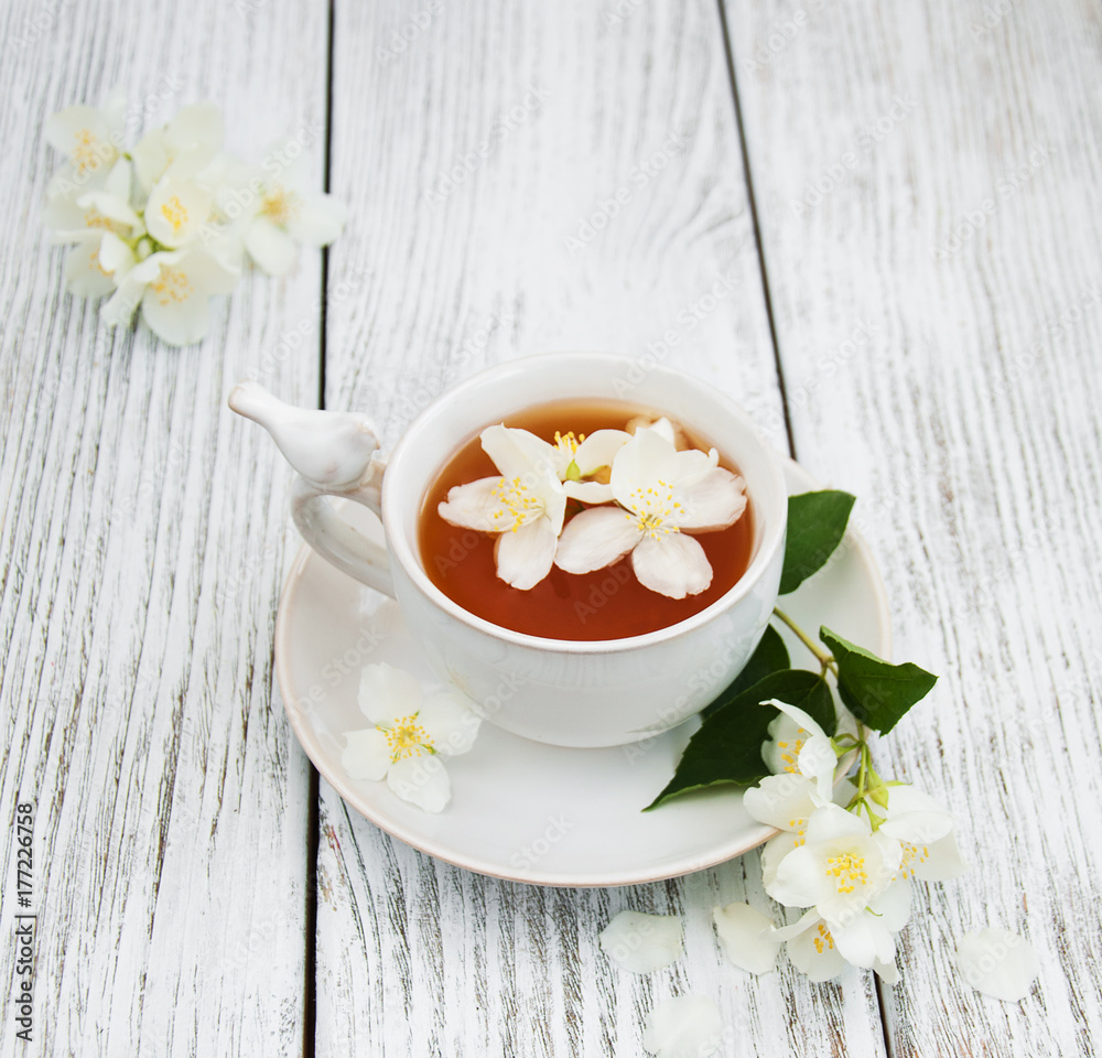 Cup of tea with jasmine flowers Cup of tea with jasmine flowers