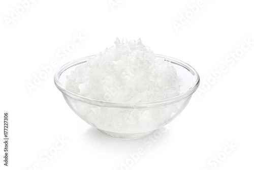 Bowl with coconut oil isolated on white background.