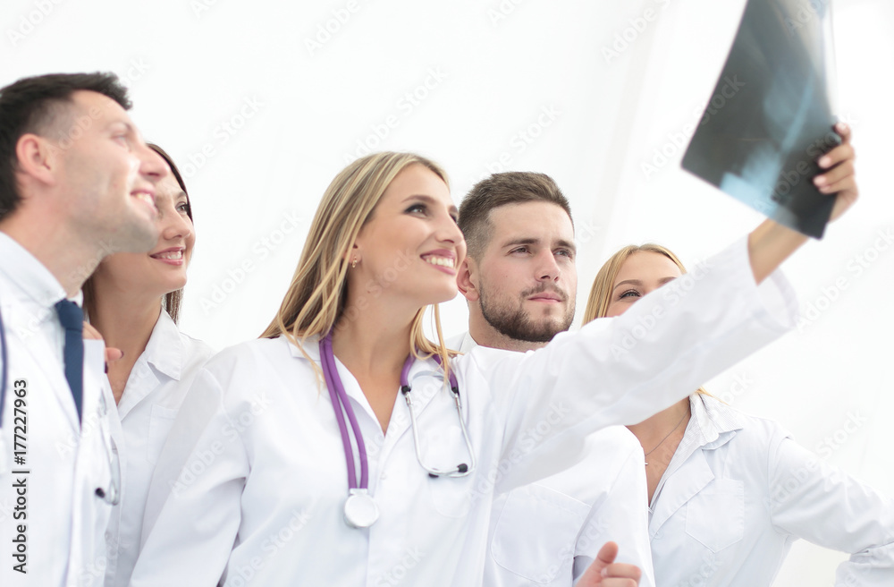 group of doctors discussing an x-ray group of doctors discussing an x-ray