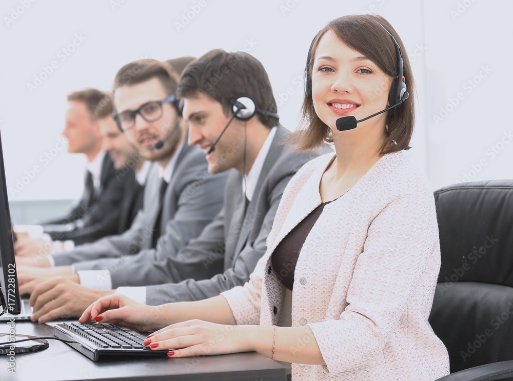 female customer service representative and colleagues in the call center
