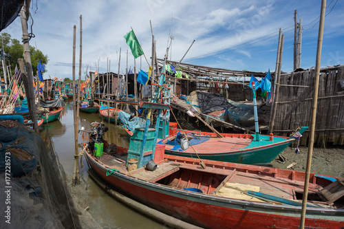 Thai small fishing boats have docked at fishing village at day time