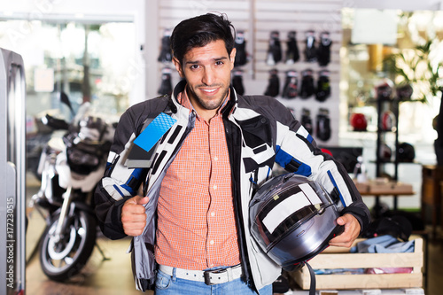 Man in moto equipment store