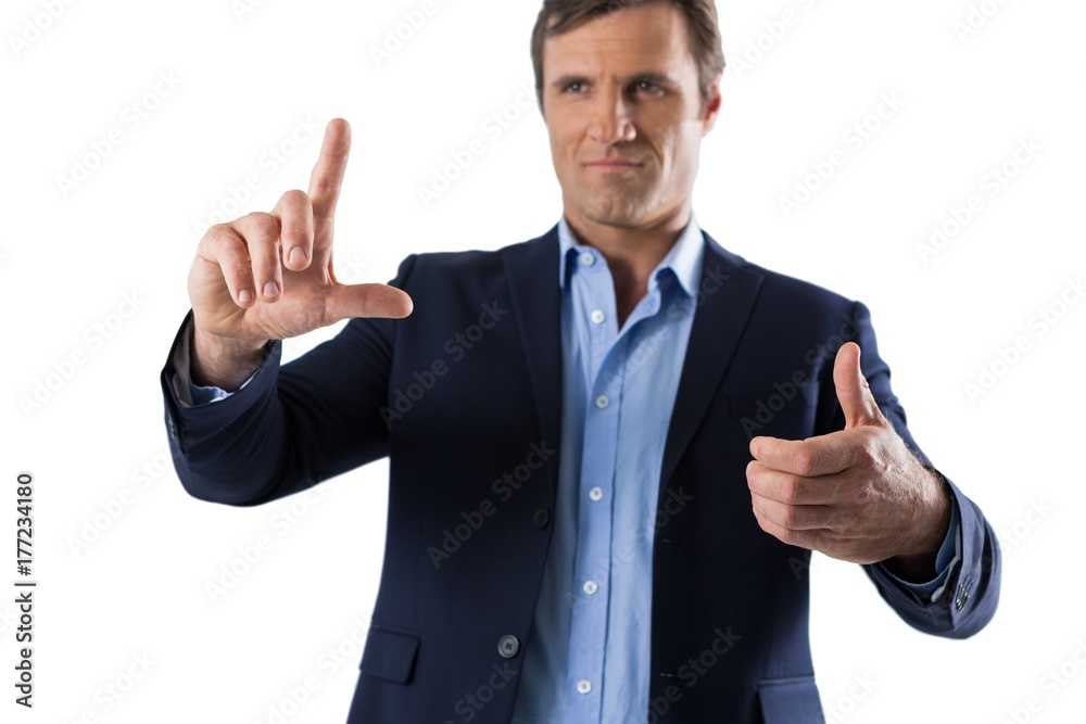 Businessman touching an invisible screen Businessman touching an invisible screen