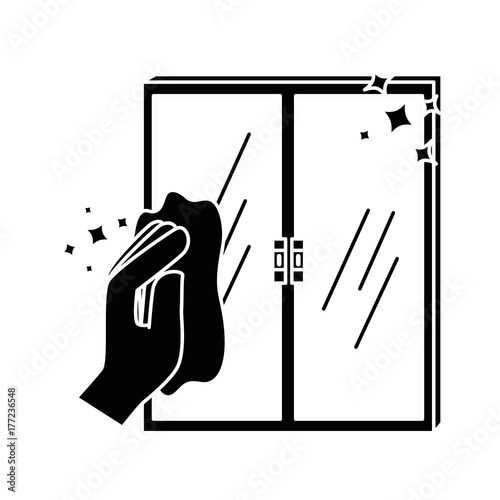 hand wiping window with cloth