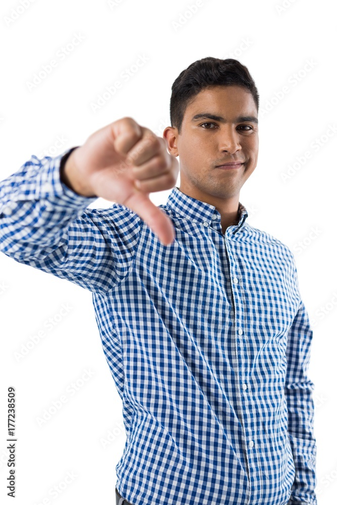 Portrait of displeased man showing thumb sign Portrait of displeased man showing thumb sign