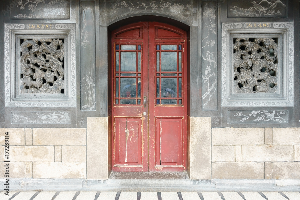 Fototapeta premium House facade with windows of an abandoned building in china