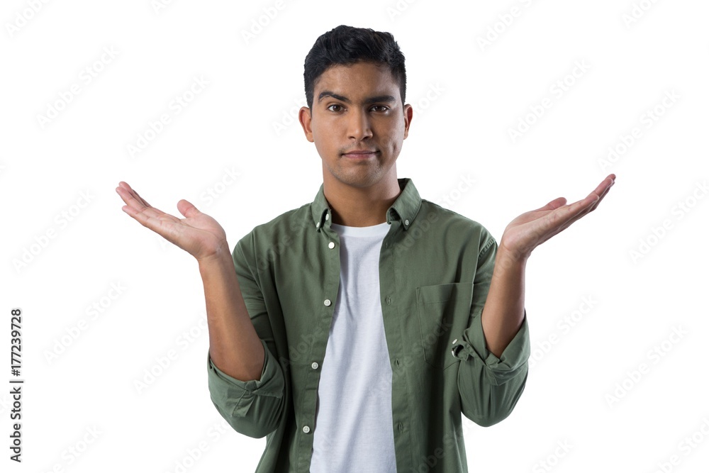 Frowning man gesturing against white background Frowning man gesturing against white background